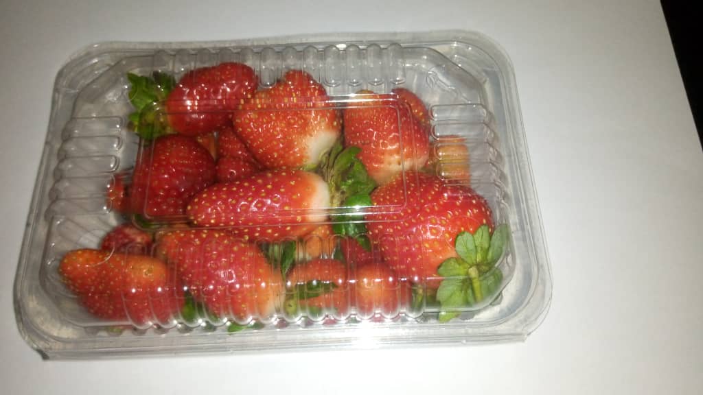 Fresh organic strawberries and strawberry jam