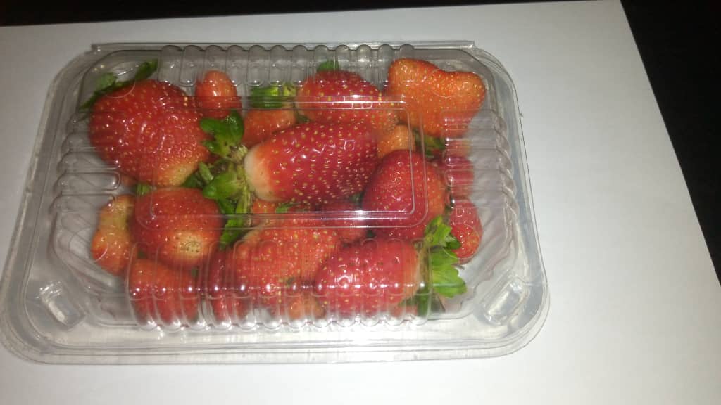 Fresh organic strawberries and strawberry jam